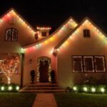 A house is perfectly decorated with Christmas lights